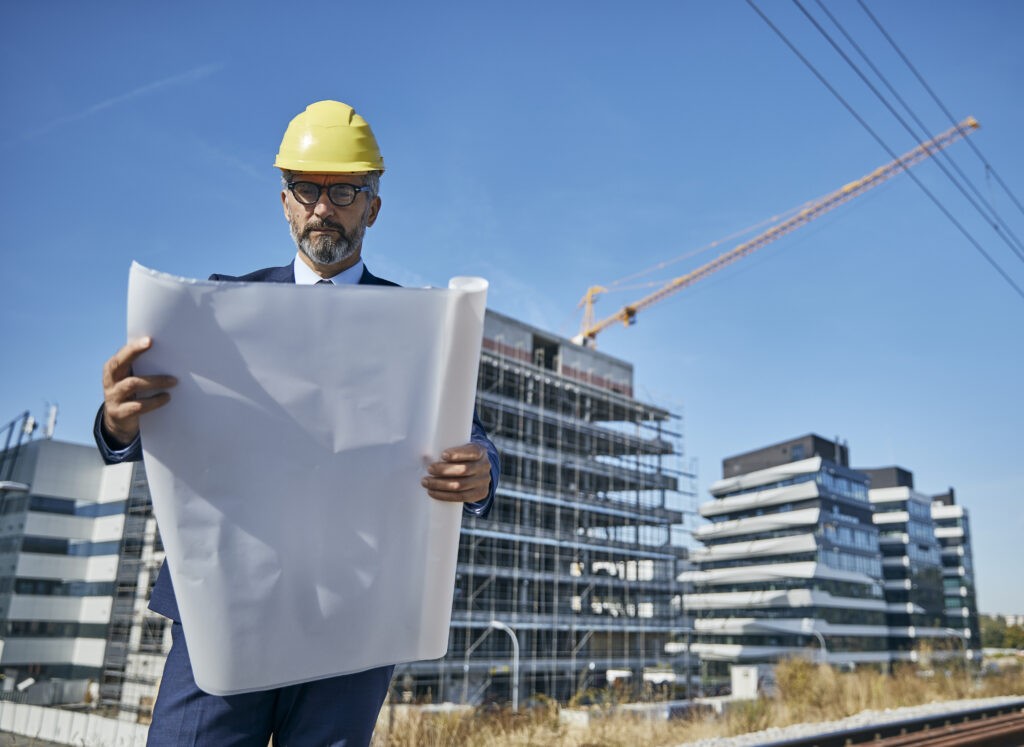 Architect reviewing blueprints