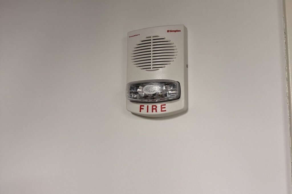 Fire alarm speaker/strobe notification appliance on a wall